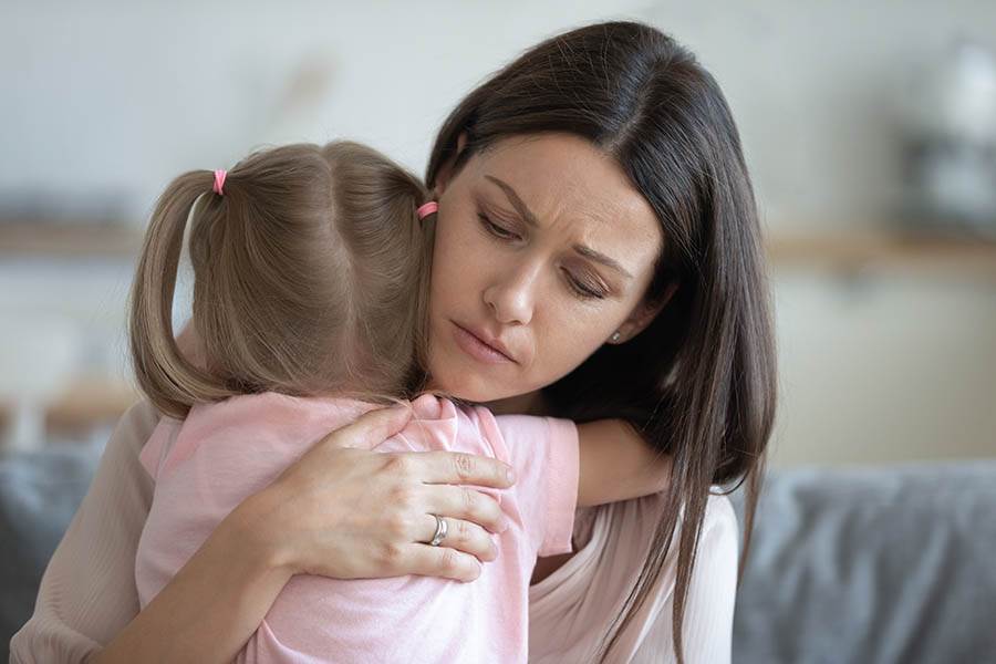 Empathic mother comforting child