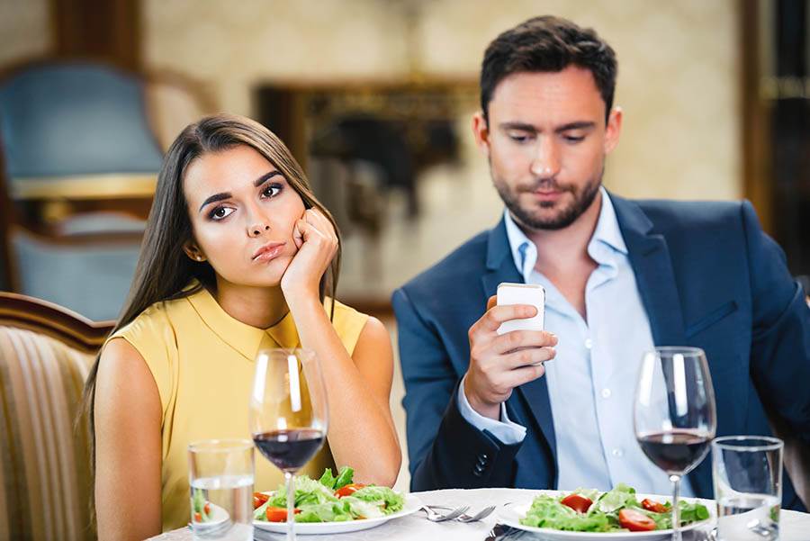 bored couple at dinner