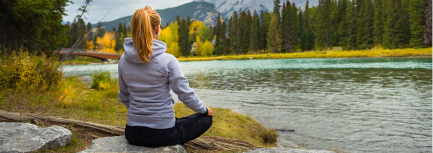 woman meditating in nature